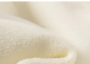 Close-up of soft white fleece lining material for children winter festive clothing