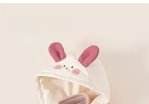 Detail of baby winter jacket hood with pink 3D bunny ears and cute rabbit embroidery