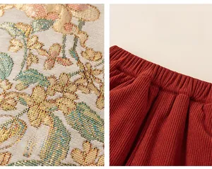 Detail of red floral jacquard fabric and elastic corduroy waistband on children's pants