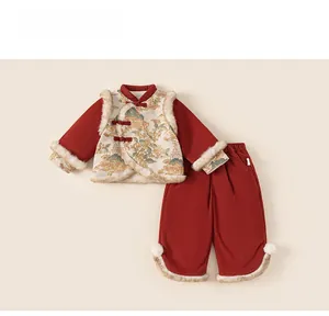 Detail view of red Chinese New Year kids' outfit featuring soft white faux fur trim and tassels