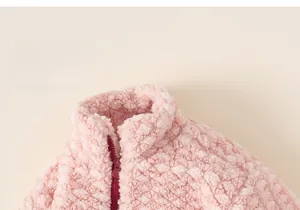 Close-up of pink fleece kids sweatshirt featuring a stand collar and red zipper detail