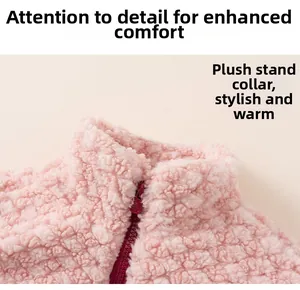 Detail of pink fleece jacket showing plush stand collar and smooth zipper closure