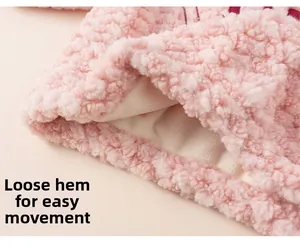 Detail view of pink fleece lining and loose hem on a warm children sweatshirt