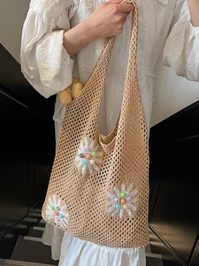 Chic beige hollow knit shoulder bag with colorful beaded daisies for beach vacations