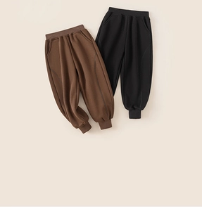 Flat lay of boys thick joggers in black and brown colors with ribbed cuffs and elastic waist