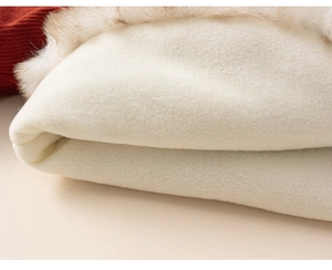 Detailed close-up of warm red children's winter top with soft white fleece lining texture