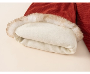 Close-up of red corduroy kids clothing with thick faux lamb wool lining and fur trim