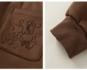 Detail of coffee brown kids winter trousers with thick fleece lining and ribbed cuffs