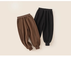 Detail of children's fleece jogger pants showing elastic waist and ribbed cuffs in brown