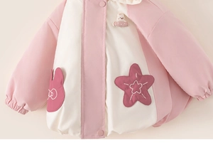 Detail of pink and white hooded cotton jacket for girls with cute rabbit embroidery
