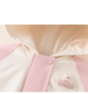 Detail view of the pink hooded jacket showing neat stitching and cute rabbit embroidery