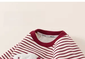 Detail of red and white striped kids sweatshirt with soft plush cartoon applique