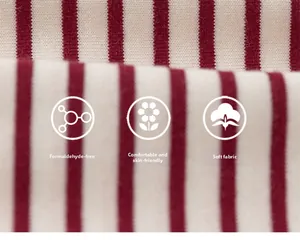 Close-up of formaldehyde-free red and white striped soft cotton fabric for kids' apparel