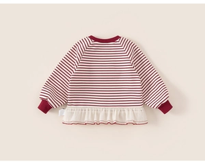 Detail of red and white striped toddler sweatshirt with ruffled hem and knit texture