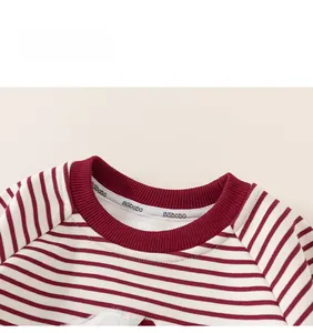 Close-up of red and white striped toddler sweatshirt with ribbed crew neck details