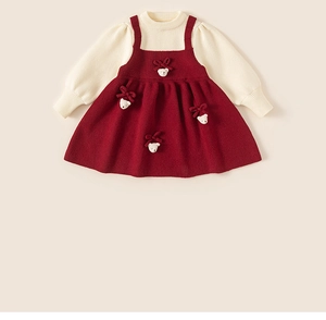 Detail of red and cream girls knit dress set with cute 3D bear and bow accent