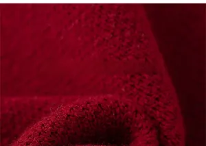 Close-up detail of the vibrant red knitted fabric showing high-quality fiber texture