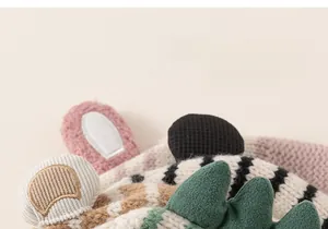 Detail of baby knit hats featuring cute 3D animal ears and fine embroidery textures