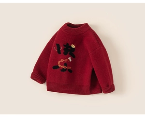 Detailed macro view of festive red knitted sweater with soft ribbed collar and cuffs