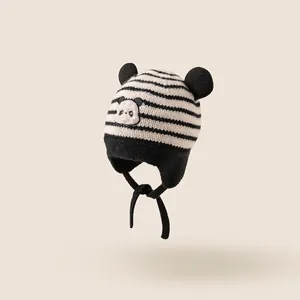 Cute panda striped knit baby hat with bear ears and chin straps for winter warmth