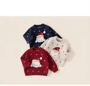 Detailed view of kids Christmas sweaters in navy, cream, and red with puppy embroidery