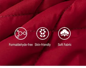 Detail of red quilted cotton fabric featuring soft skin-friendly texture for winter dress