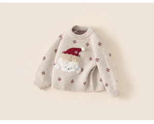Detailed view of beige knit sweater featuring red snowflakes and a 3D puppy motif