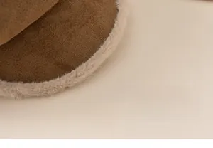 Close-up of brown suede beret hat featuring soft beige plush fur trim for kids