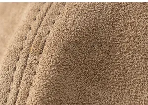 Detailed view of the thick brown fleece lining and durable stitching of the beret hat