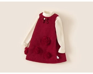 Detail view of girls burgundy tweed dress with bow and knit sweater two-piece set