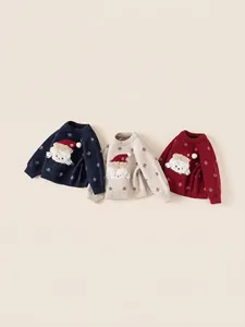 Three children's Christmas knit sweaters featuring embroidered polar bears in festive colors
