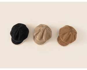 Flat lay of kids newsboy caps in black, khaki, and brown with faux lamb wool trim detail