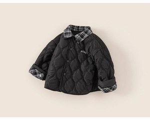 Detailed shot of black quilted kids jacket with contrast gingham collar and BOBO embroidery