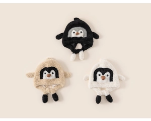 Close-up of soft plush penguin earflap hats for kids in black, beige and white