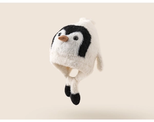 Close-up of cute penguin baby hat with soft faux fur texture and earflaps for winter
