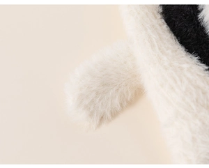 Detail of plush faux fur fabric showing soft black and white texture for kids hat