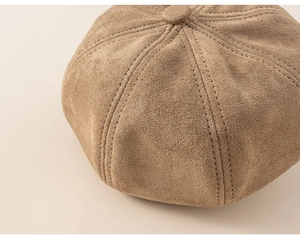 Detailed close-up of stitching and suede texture on light brown kids painter hat