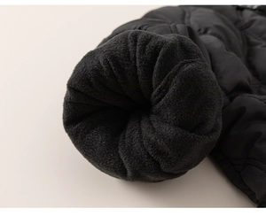 Detail of winter jacket sleeve with warm black fleece lining and waterproof coating