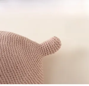 Macro view of knit hat featuring a unique 3D pointed top and thick woven texture