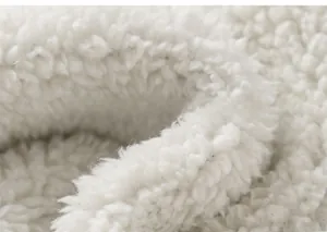 Detail showing soft white sherpa fleece lining for warmth and comfort on kids jeans