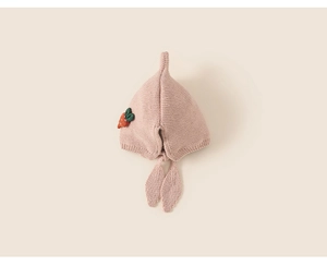 Detailed knit texture of pink baby earflap hat with cute strawberry accent and tie