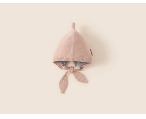 Detailed knit of pink baby elf hat with soft chin straps and skin-friendly lining
