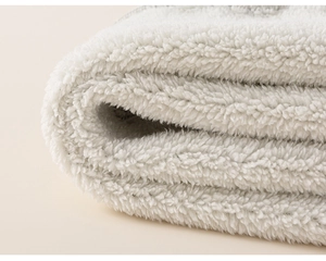 Detailed macro view of soft white sherpa fleece lining showing thick plush texture
