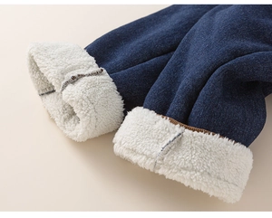 Detail view of boys' winter denim pants with thick warm fleece lining and cuffed ankles