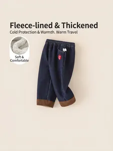 Boys warm winter denim jeans in navy blue with cozy white fleece lining and corduroy hem
