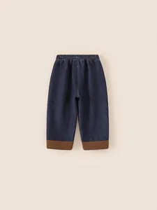 Boy's navy denim jeans with brown corduroy cuffs and elastic waist for winter warmth