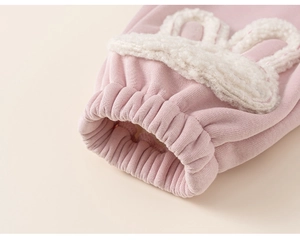 Detail of pink toddler fleece pants showing ribbed elastic cuffs and cute bunny ear embroidery