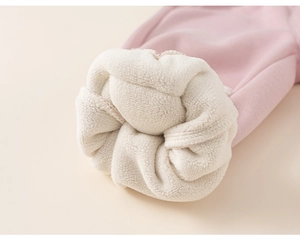 Close-up of thick white fleece lining and rolled cuff on pink thermal children's pants