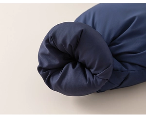 Detailed macro view of dark blue quilted sleeve cuffs with thick warm padding