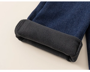 Close-up of kids denim jeans showing thick black fleece lining and cuffed leg detail